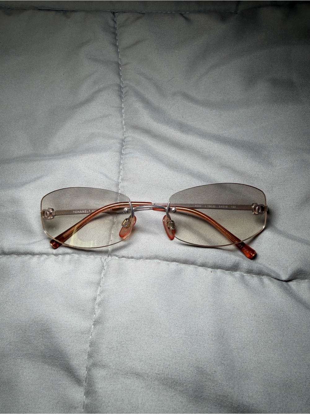 CHANEL Rimless Sunglasses with Light Brown/Amber Temples
